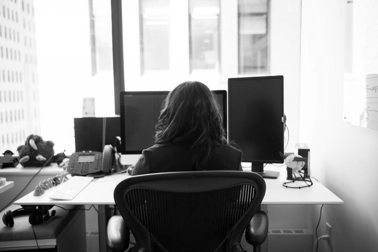 Office workspace showing blockchain development environment and collaboration tools